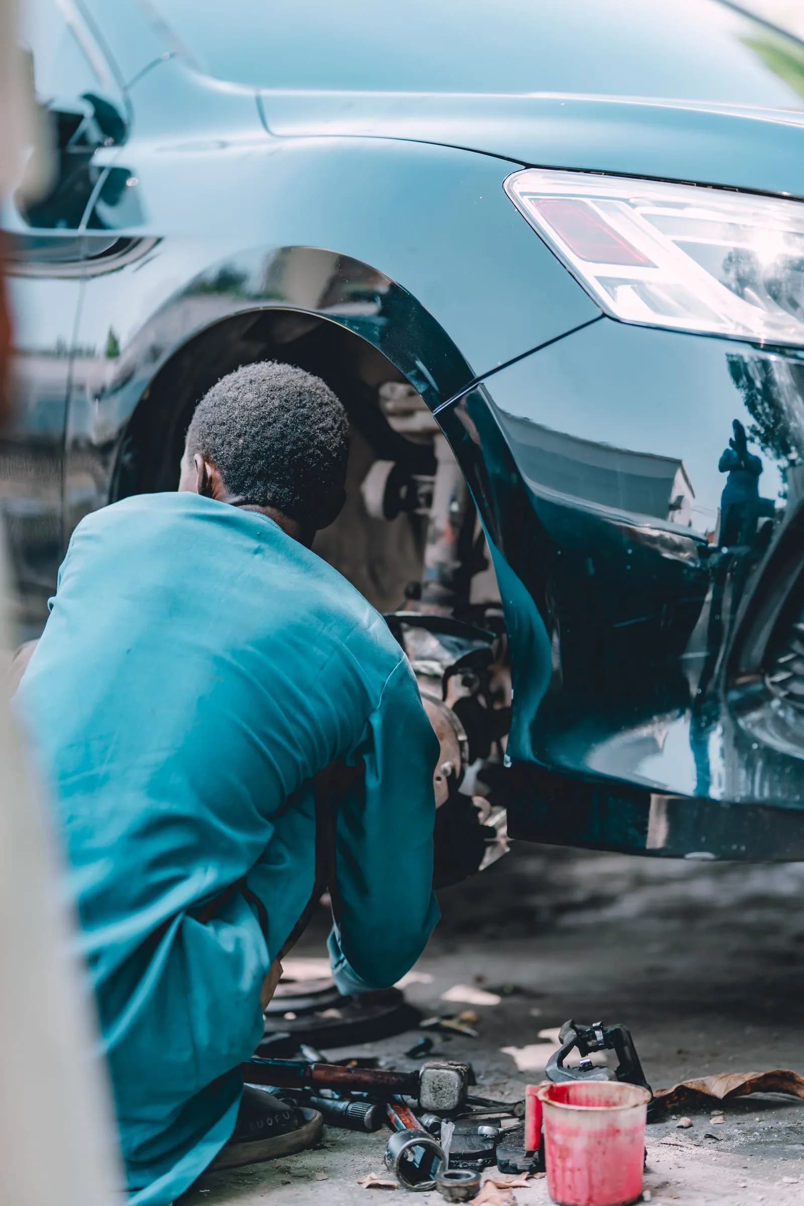 Technician servicing vehicle — Automotive marketing by TML Agency