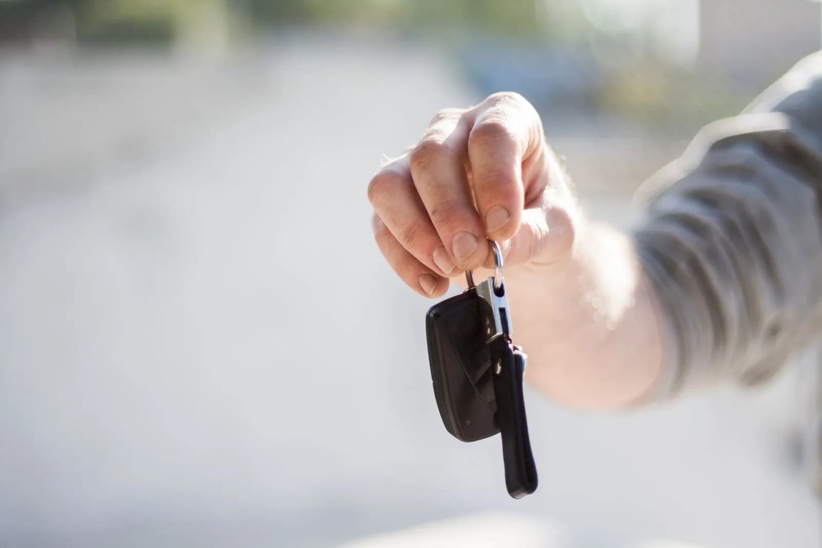 Dealer handing keys owner — Car Dealerships & Auto Dealers marketing by TML Agency