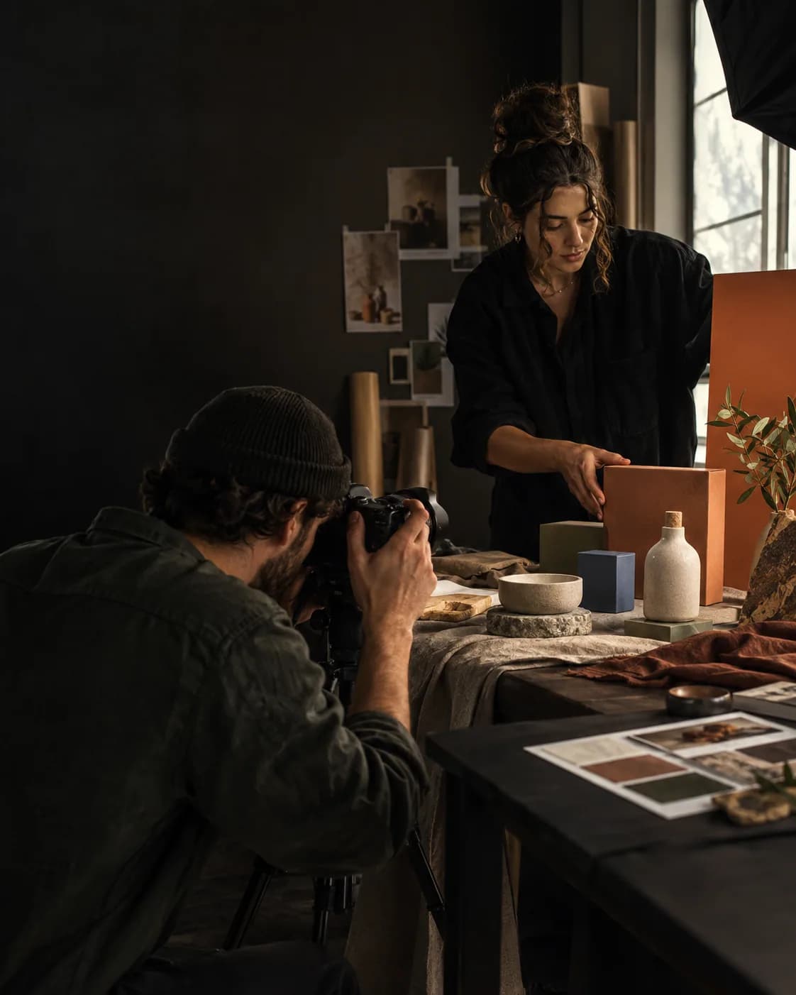 Art director and product stylist arranging packaging for a campaign — TML Agency